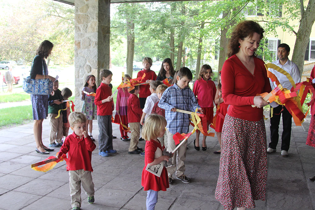 Children of Trinity in joyful Pentecost procession