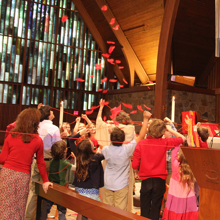 Youth of Trinity celebrating Pentecost in the sanctuary