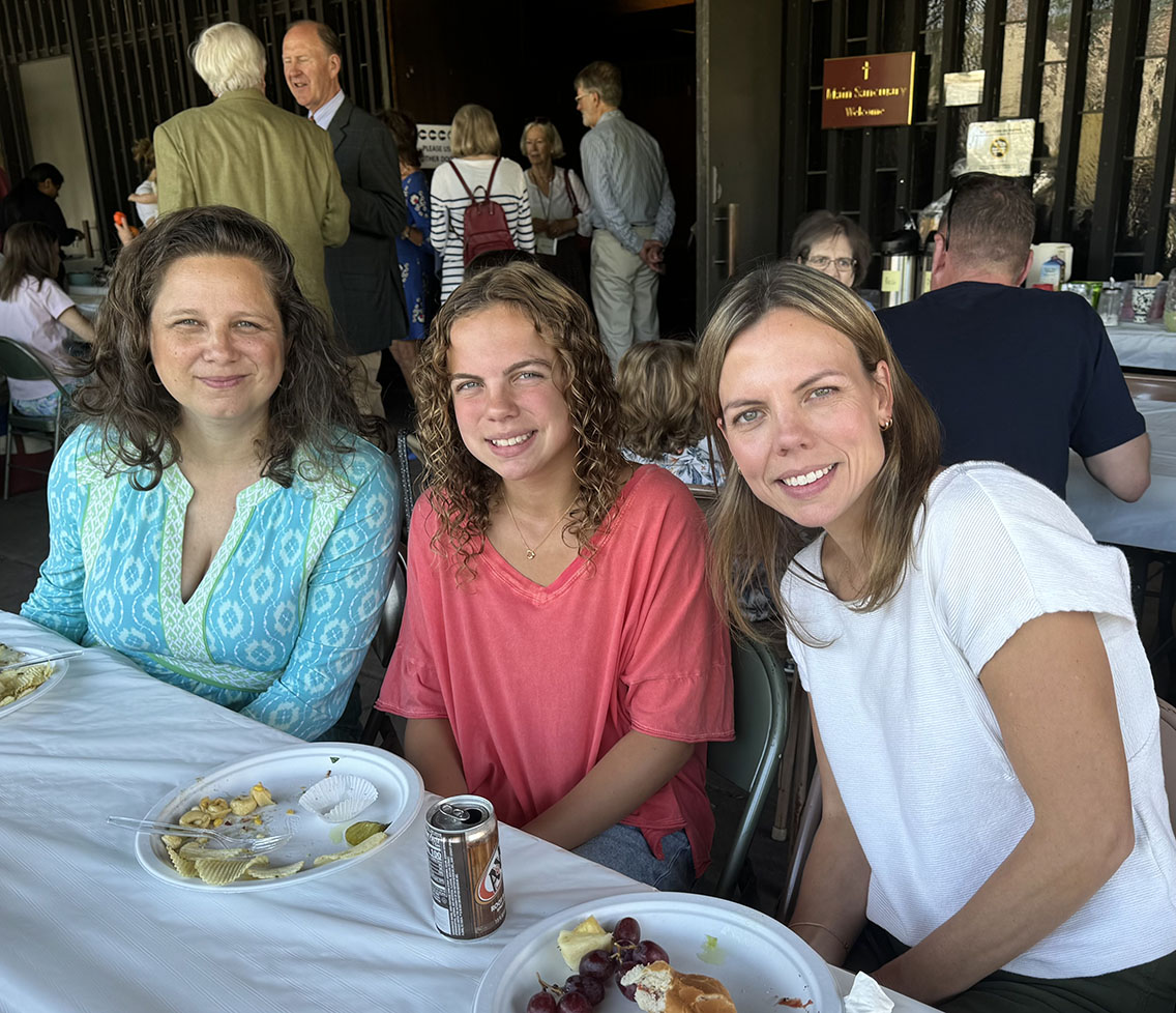 Parishioners enjoying a picnic on Trinity's porch